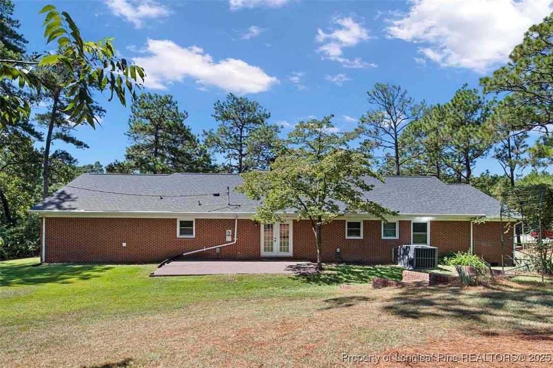 2434 North Bragg Boulevard Spring Lake, NC 28390 - Photo 43 of 44 a view of a yard in front of a house with large tree