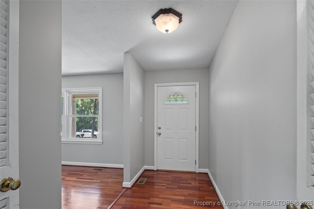 2434 North Bragg Boulevard Spring Lake, NC 28390 - Photo 5 of 44 an empty room with windows