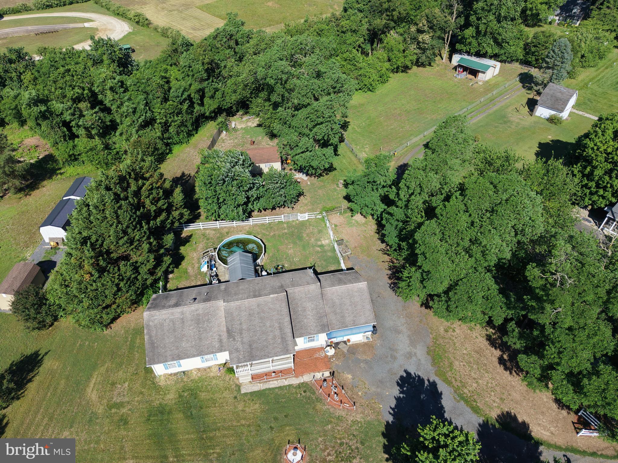 7112 East New Market Ellwood Road Hurlock, MD 21643 - Photo 40 of 41 an aerial view of a house with a yard basket ball court and outdoor seating