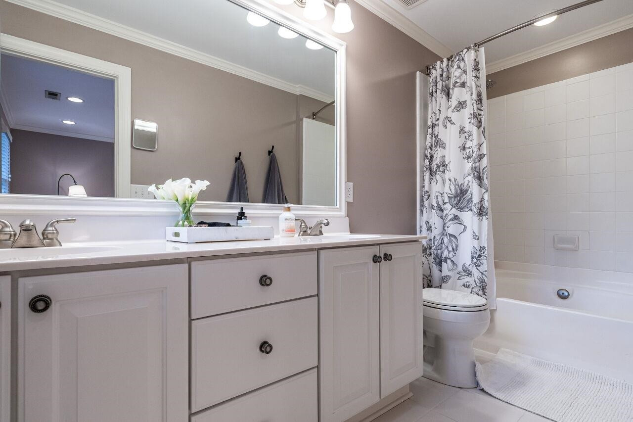 1802 Saluda Court Raleigh, NC 27608 - Photo 18 of 22 Primary Bathroom with double vanities, garden tub and shower. Primary Bathroom