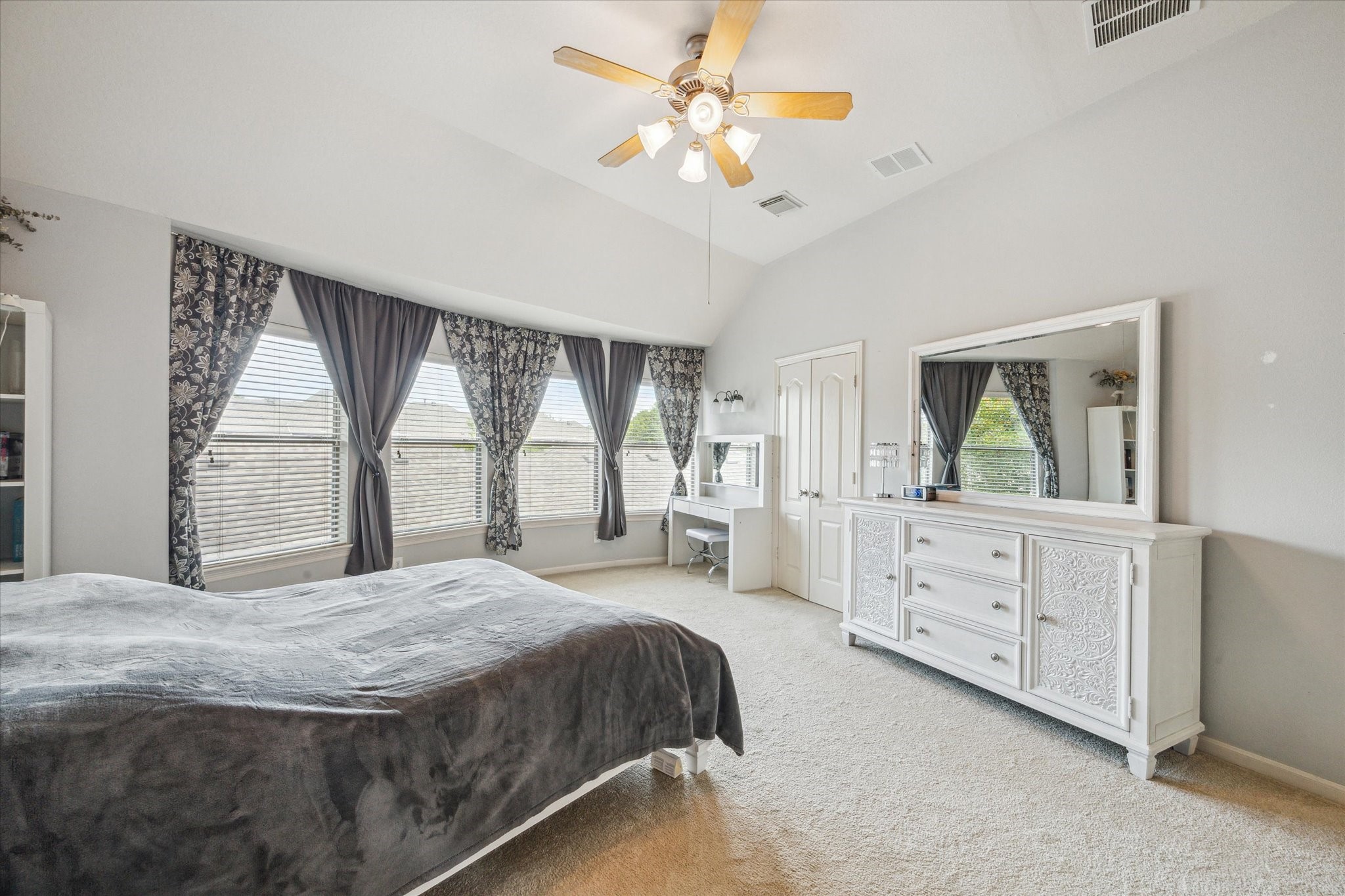 2403 Clippers Square Houston, TX 77058 - Photo 13 of 20 a spacious bedroom with a large bed and a dresser