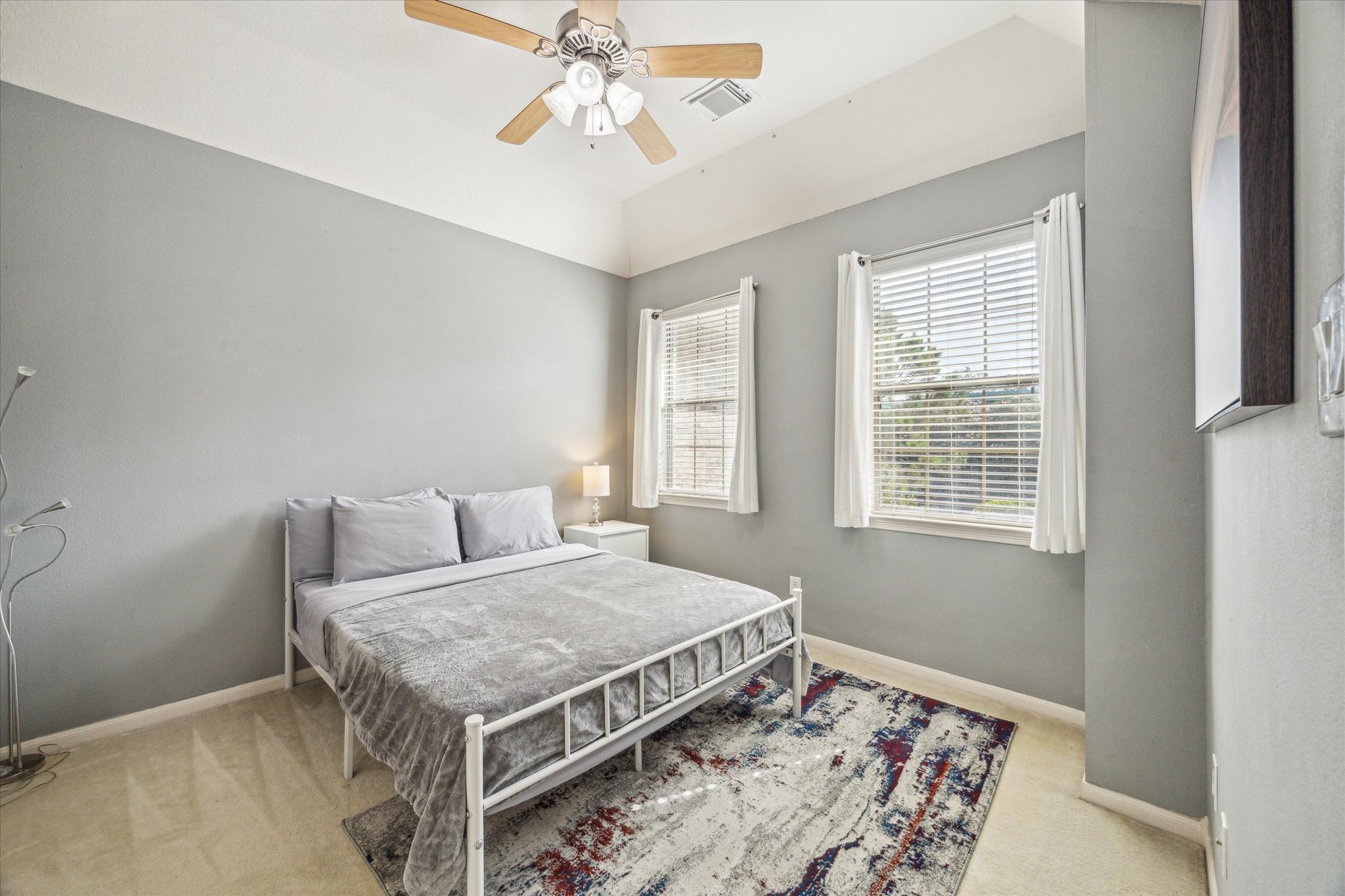 2403 Clippers Square Houston, TX 77058 - Photo 15 of 20 a bedroom with a bed and a chandelier