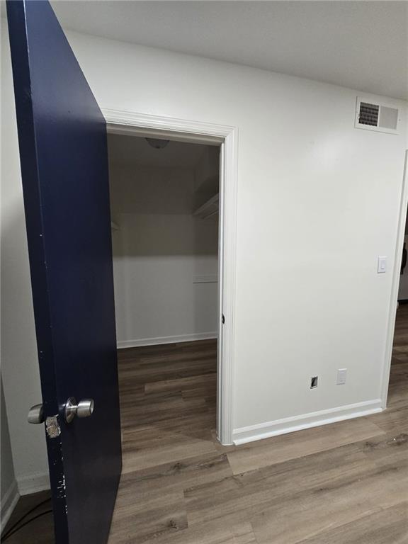 177 Rue Fontaine, Unit 2 Stonecrest, GA 30038 - Photo 5 of 7 an empty room with wooden floor