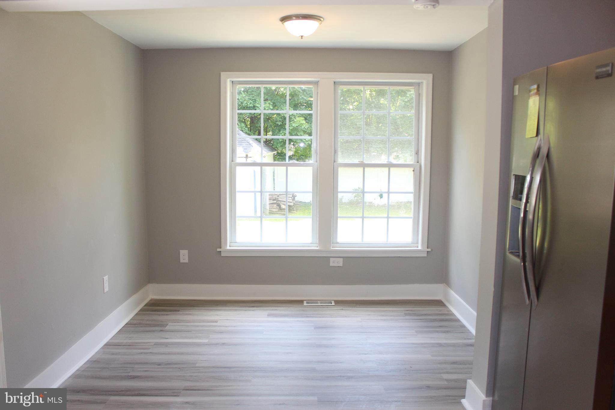 25 Church Street Glassboro, NJ 08028 - Photo 13 of 21 a view of an empty room with wooden floor and a window