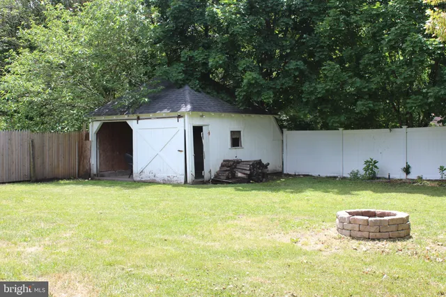 a view of a couches in backyard of house