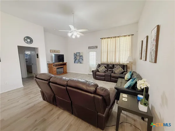 a living room with furniture and a window