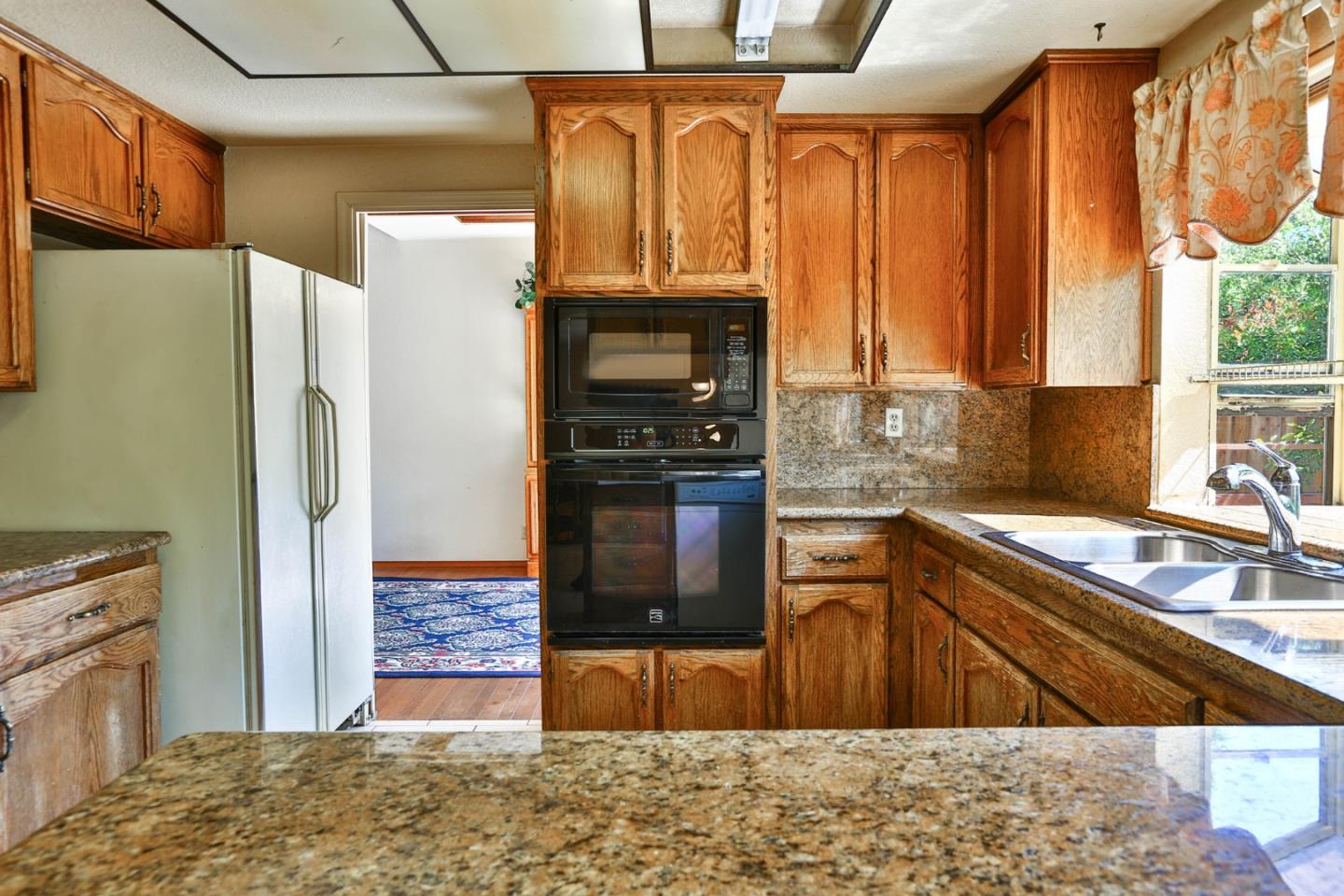 6964 McCall Drive San Jose, CA 95120 - Photo 11 of 57 a kitchen with stainless steel appliances granite countertop a refrigerator and a sink
