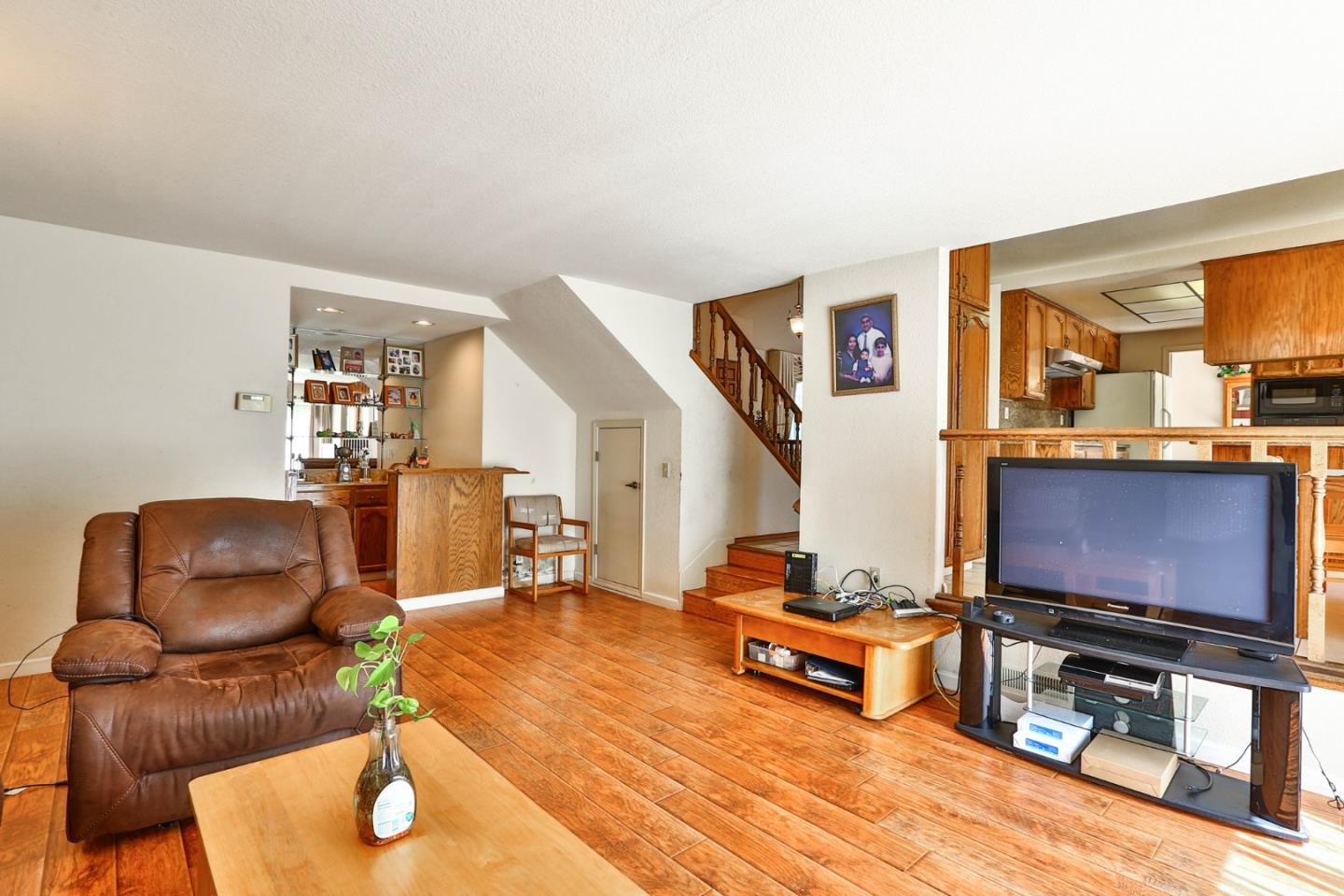 6964 McCall Drive San Jose, CA 95120 - Photo 15 of 57 a living room with furniture and a flat screen tv