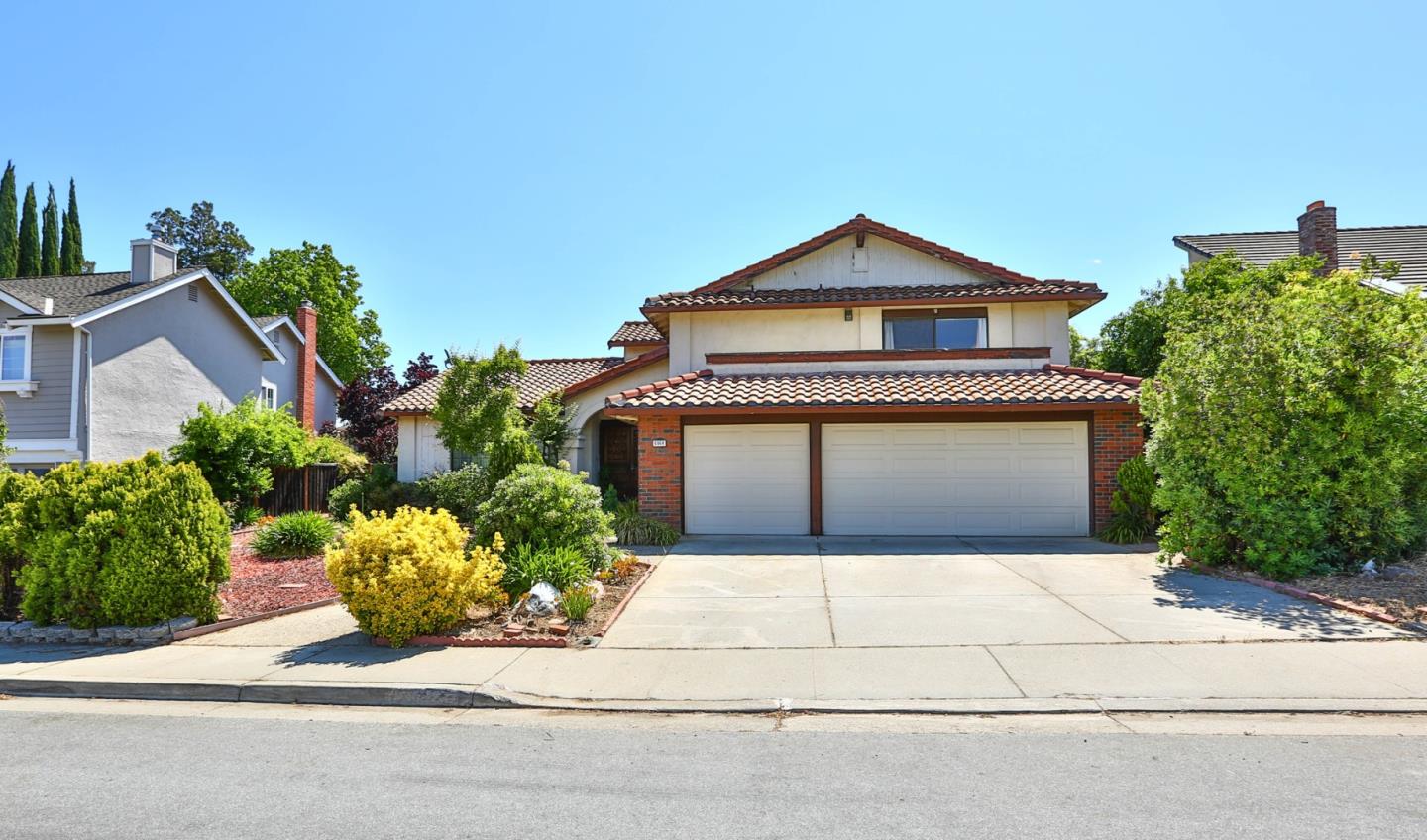 6964 McCall Drive San Jose, CA 95120 - Photo 2 of 57 a front view of a house with a yard and garage