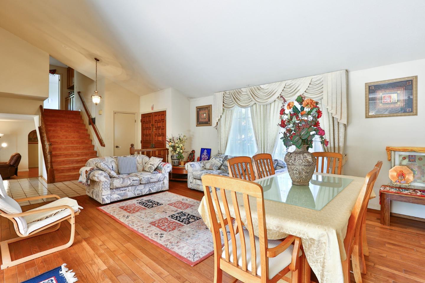 6964 McCall Drive San Jose, CA 95120 - Photo 22 of 57 a living room with furniture and wooden floor