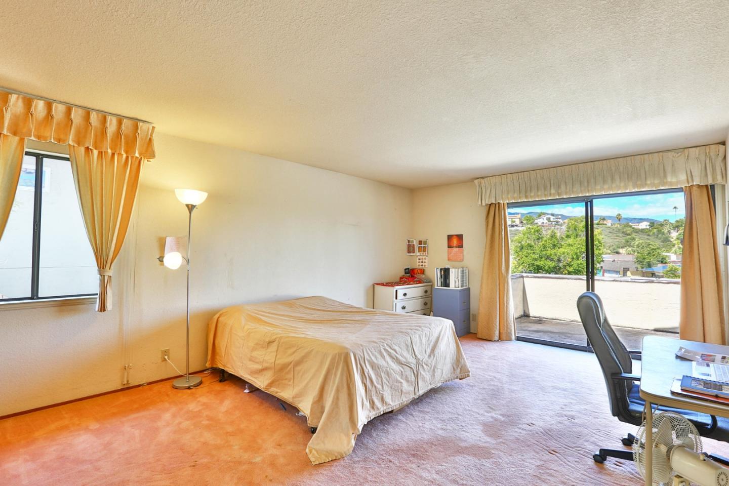 6964 McCall Drive San Jose, CA 95120 - Photo 27 of 57 a bedroom with a bed and a large window
