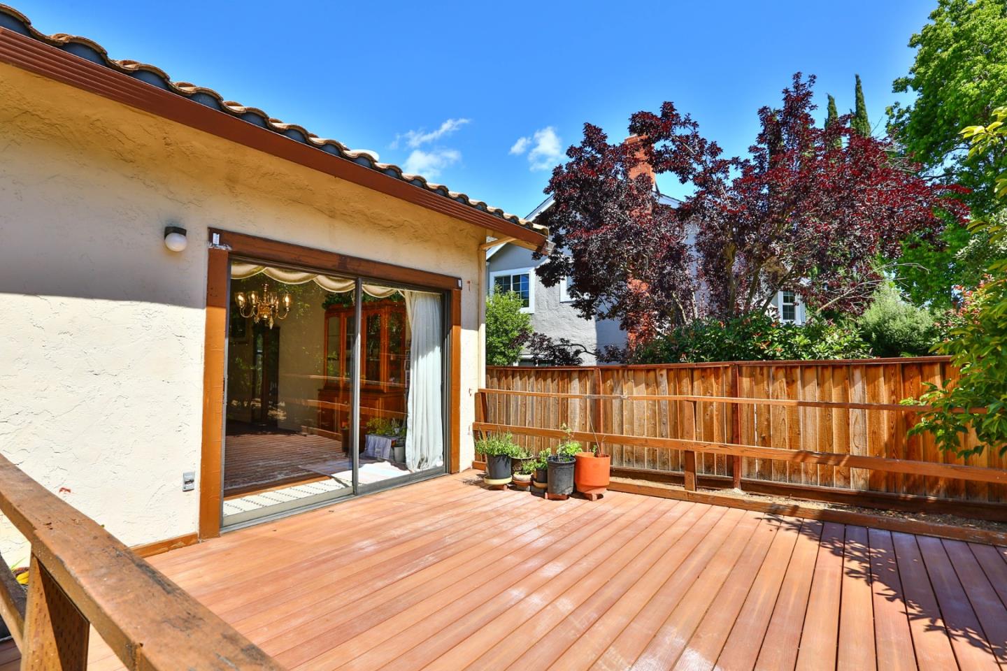6964 McCall Drive San Jose, CA 95120 - Photo 31 of 57 a view of backyard with swimming pool and wooden fence