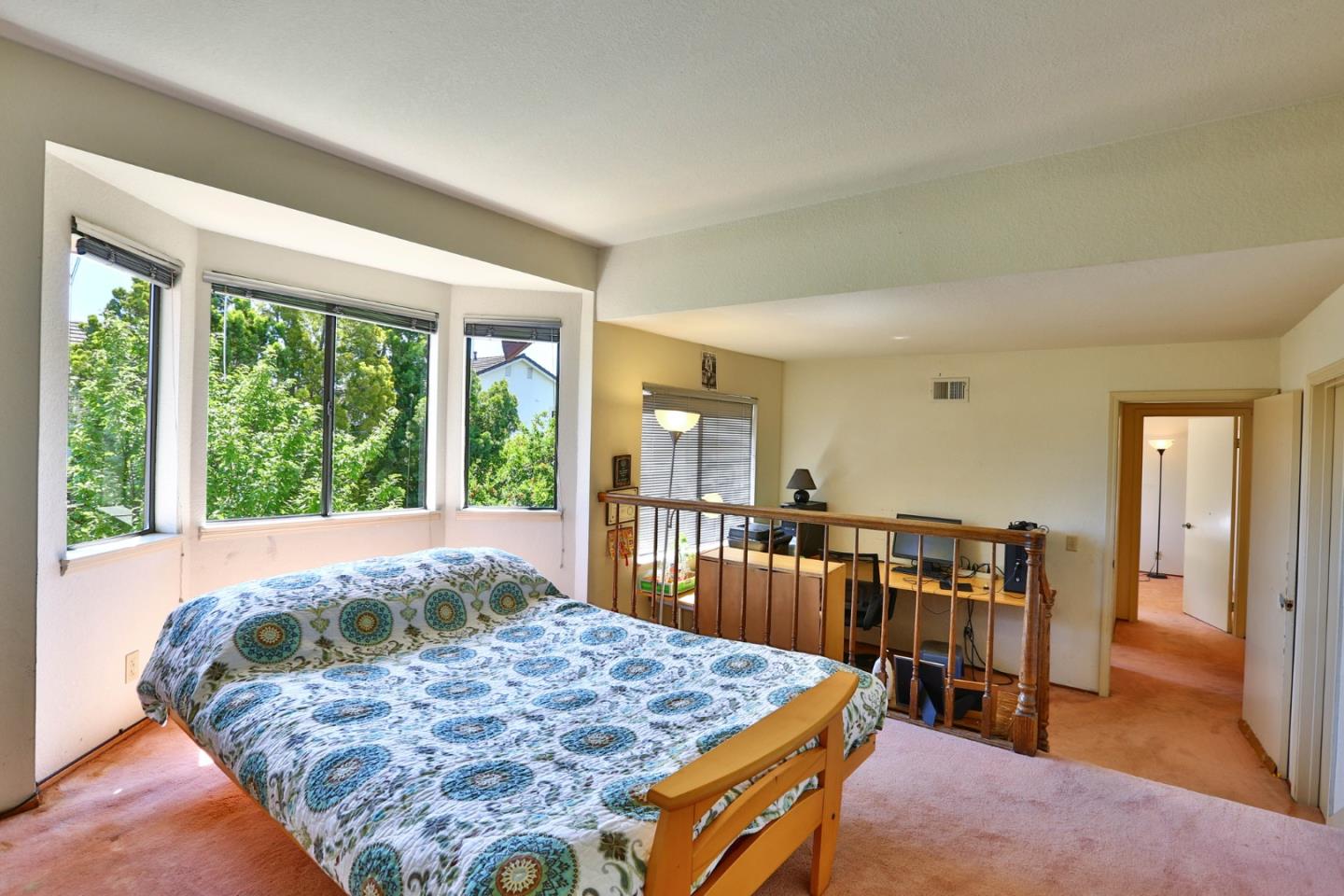 6964 McCall Drive San Jose, CA 95120 - Photo 36 of 57 a bed sitting in a spacious bedroom next to a window