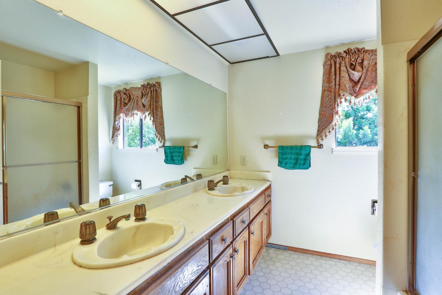 6964 McCall Drive San Jose, CA 95120 - Photo 37 of 57 a bathroom with a sink and a mirror