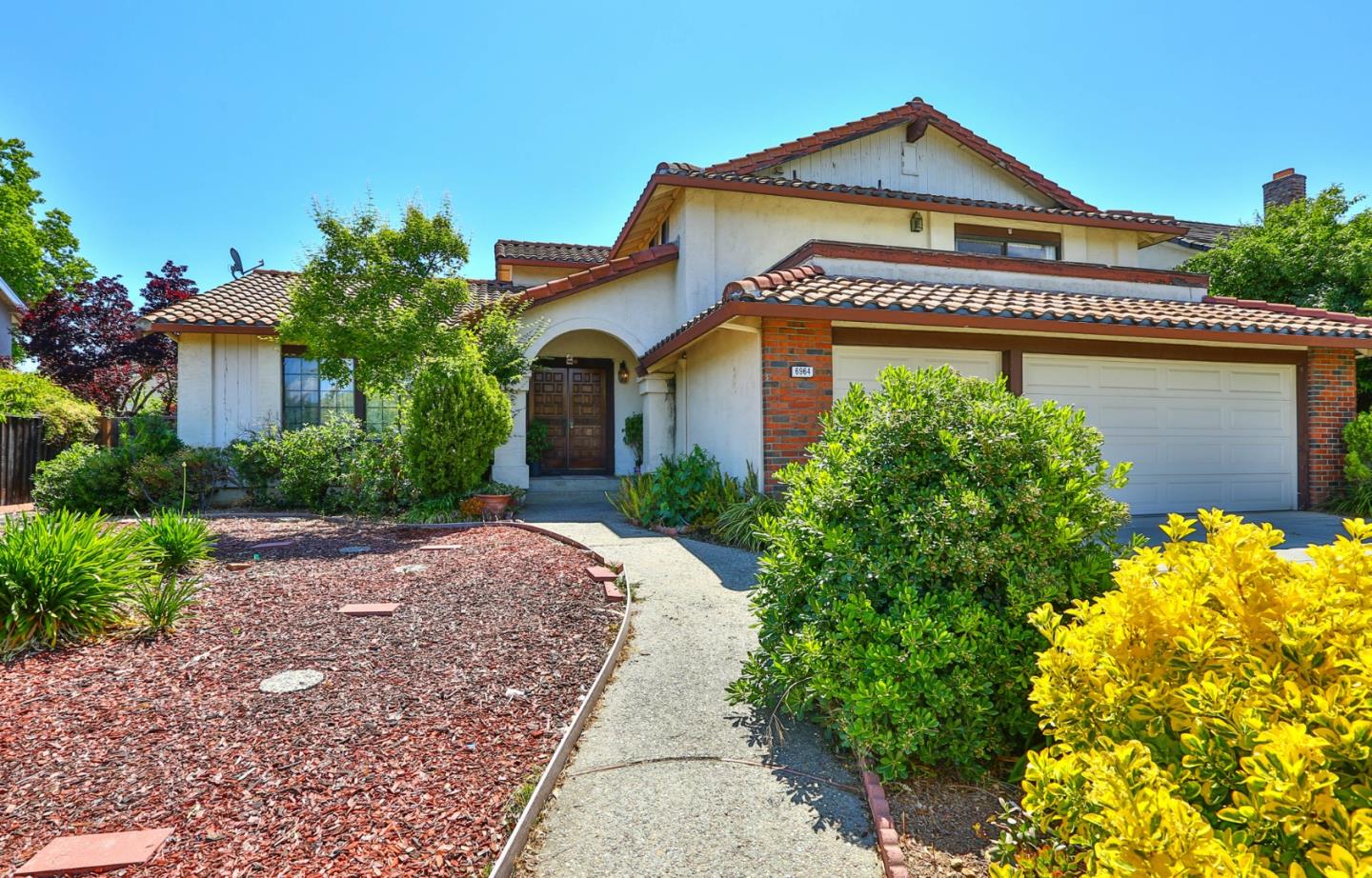6964 McCall Drive San Jose, CA 95120 - Photo 5 of 57 a front view of a house with garden
