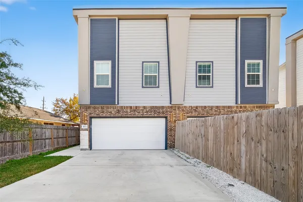 a front view of a house with a garage
