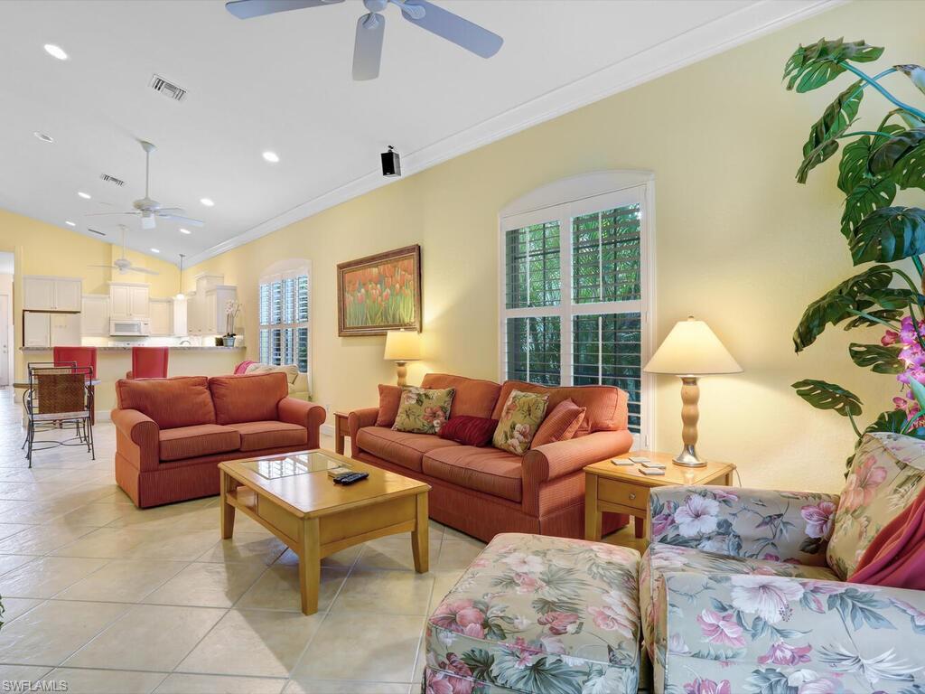 1079 Michigan Avenue Naples, FL 34103 - Photo 13 of 31 a living room with furniture and a window