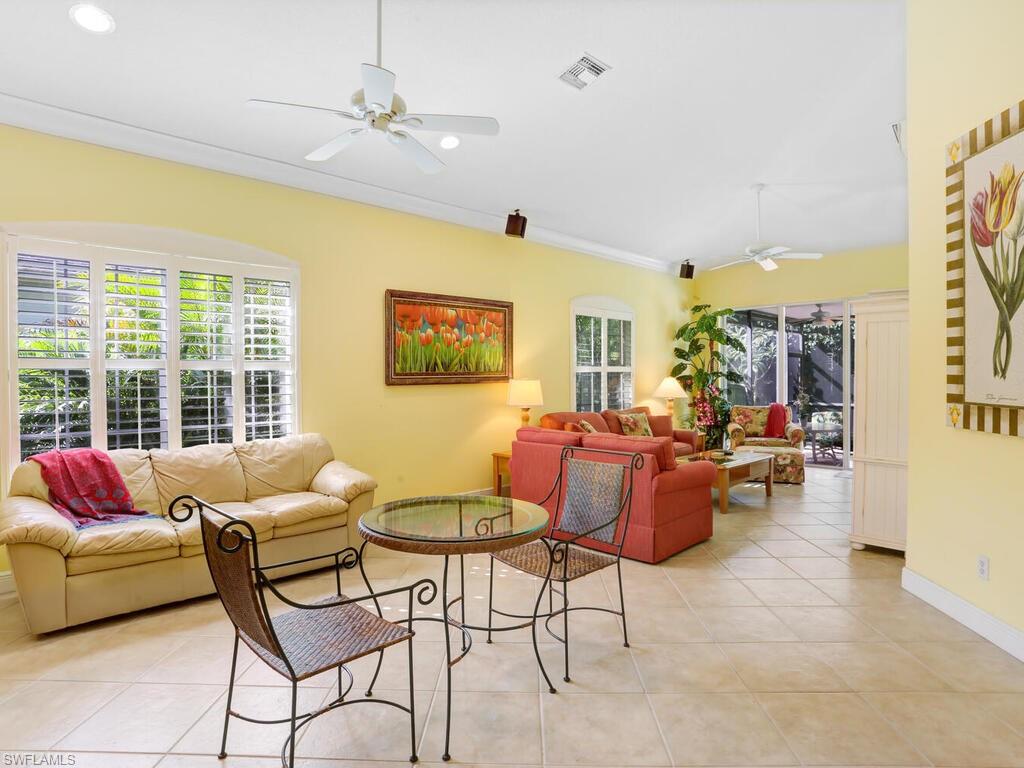 1079 Michigan Avenue Naples, FL 34103 - Photo 14 of 31 a living room with furniture and a large window