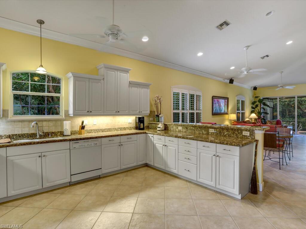 1079 Michigan Avenue Naples, FL 34103 - Photo 21 of 31 a large kitchen with lots of counter space and a sink