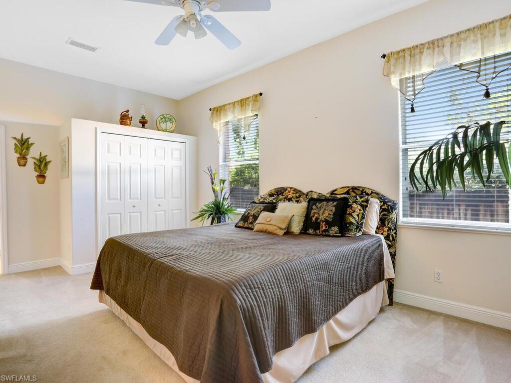 1079 Michigan Avenue Naples, FL 34103 - Photo 28 of 31 a bedroom with a bed and a window