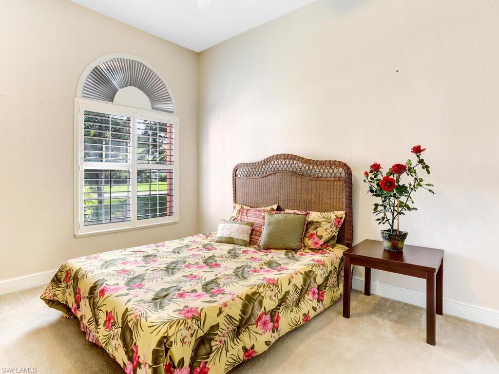 1079 Michigan Avenue Naples, FL 34103 - Photo 30 of 31 a bedroom with a bed and a window