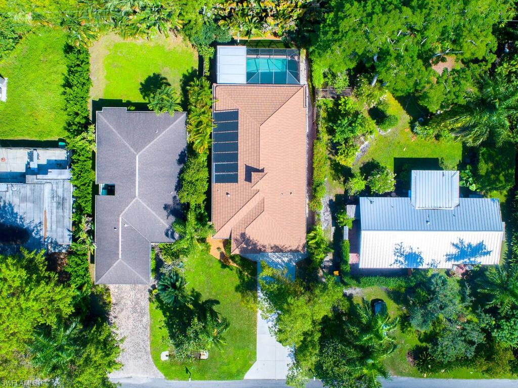 1079 Michigan Avenue Naples, FL 34103 - Photo 3 of 31 an aerial view of a house with a yard and garden