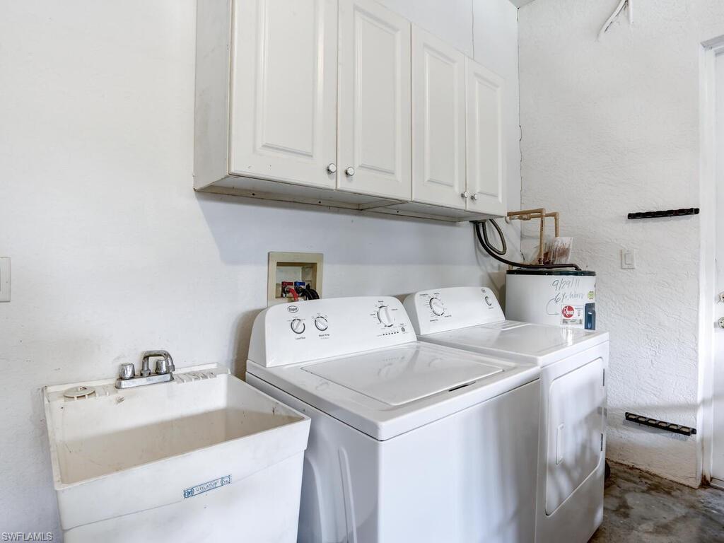 1079 Michigan Avenue Naples, FL 34103 - Photo 31 of 31 a utility room with dryer and washer