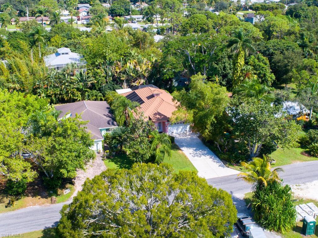 1079 Michigan Avenue Naples, FL 34103 - Photo 4 of 31 an aerial view of residential house with outdoor space and trees all around