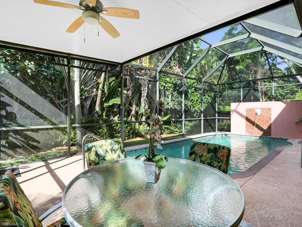 1079 Michigan Avenue Naples, FL 34103 - Photo 8 of 31 swimming pool view with a garden view