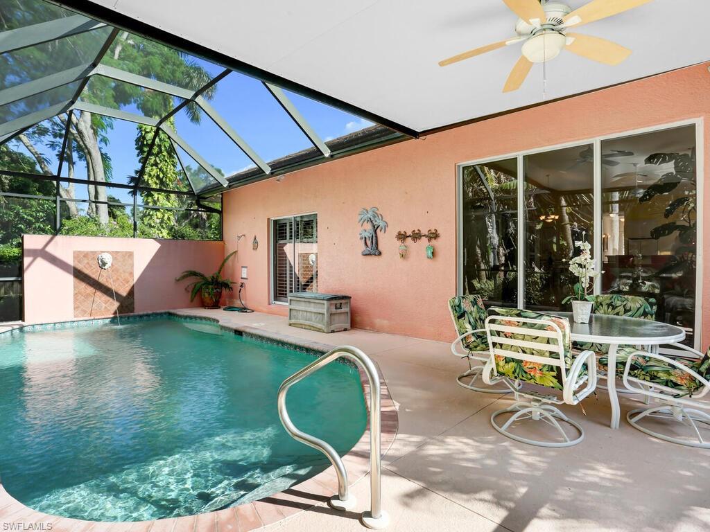 1079 Michigan Avenue Naples, FL 34103 - Photo 10 of 31 a view of a patio with a table and chairs