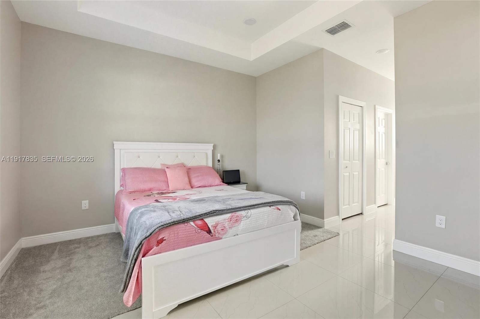 2908 9th Street Southwest Lehigh Acres, FL 33976 - Photo 18 of 44 a bedroom with a bed and a window