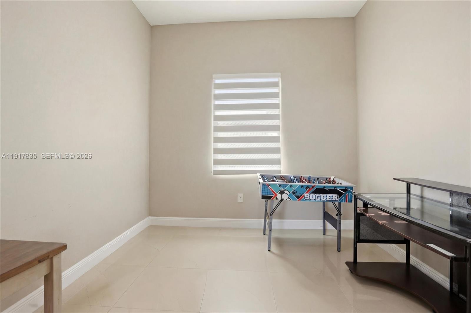 2908 9th Street Southwest Lehigh Acres, FL 33976 - Photo 25 of 44 a reading room with furniture and window
