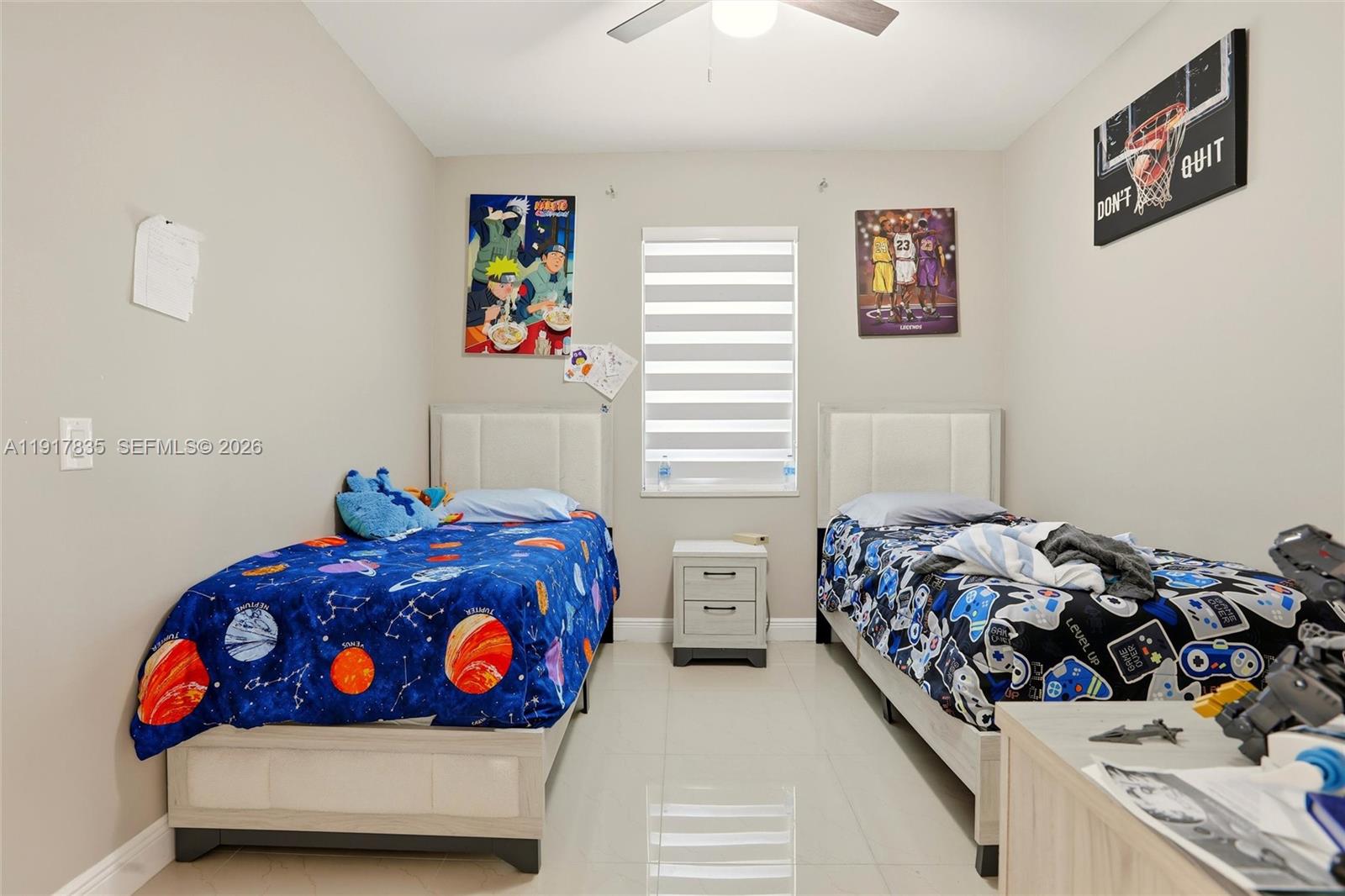 2908 9th Street Southwest Lehigh Acres, FL 33976 - Photo 30 of 44 a bedroom with bed and a window