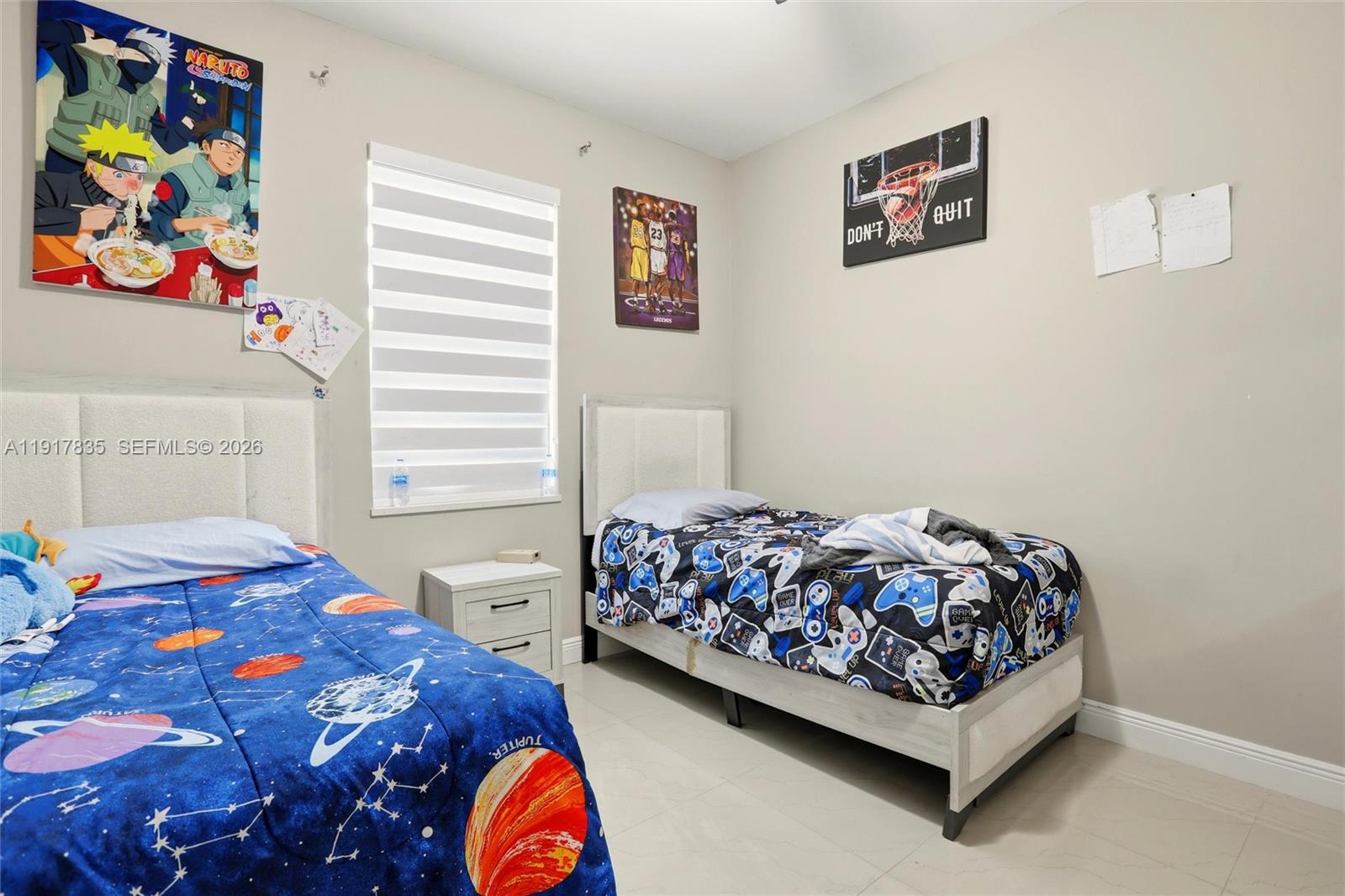 2908 9th Street Southwest Lehigh Acres, FL 33976 - Photo 32 of 44 a bedroom with a bed and a painting on the wall