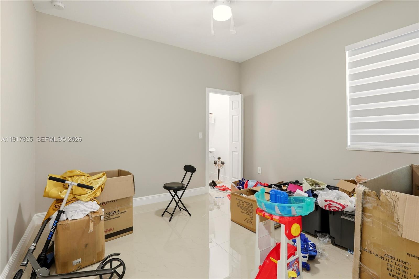 2908 9th Street Southwest Lehigh Acres, FL 33976 - Photo 36 of 44 a view of kids room with toys