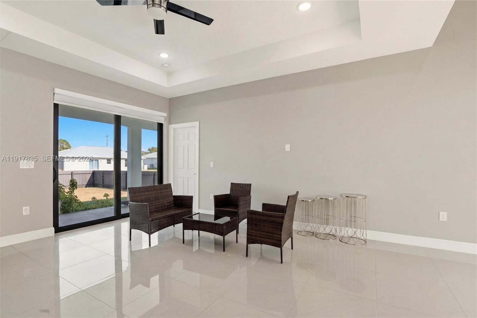 2908 9th Street Southwest Lehigh Acres, FL 33976 - Photo 4 of 44 a living room with furniture