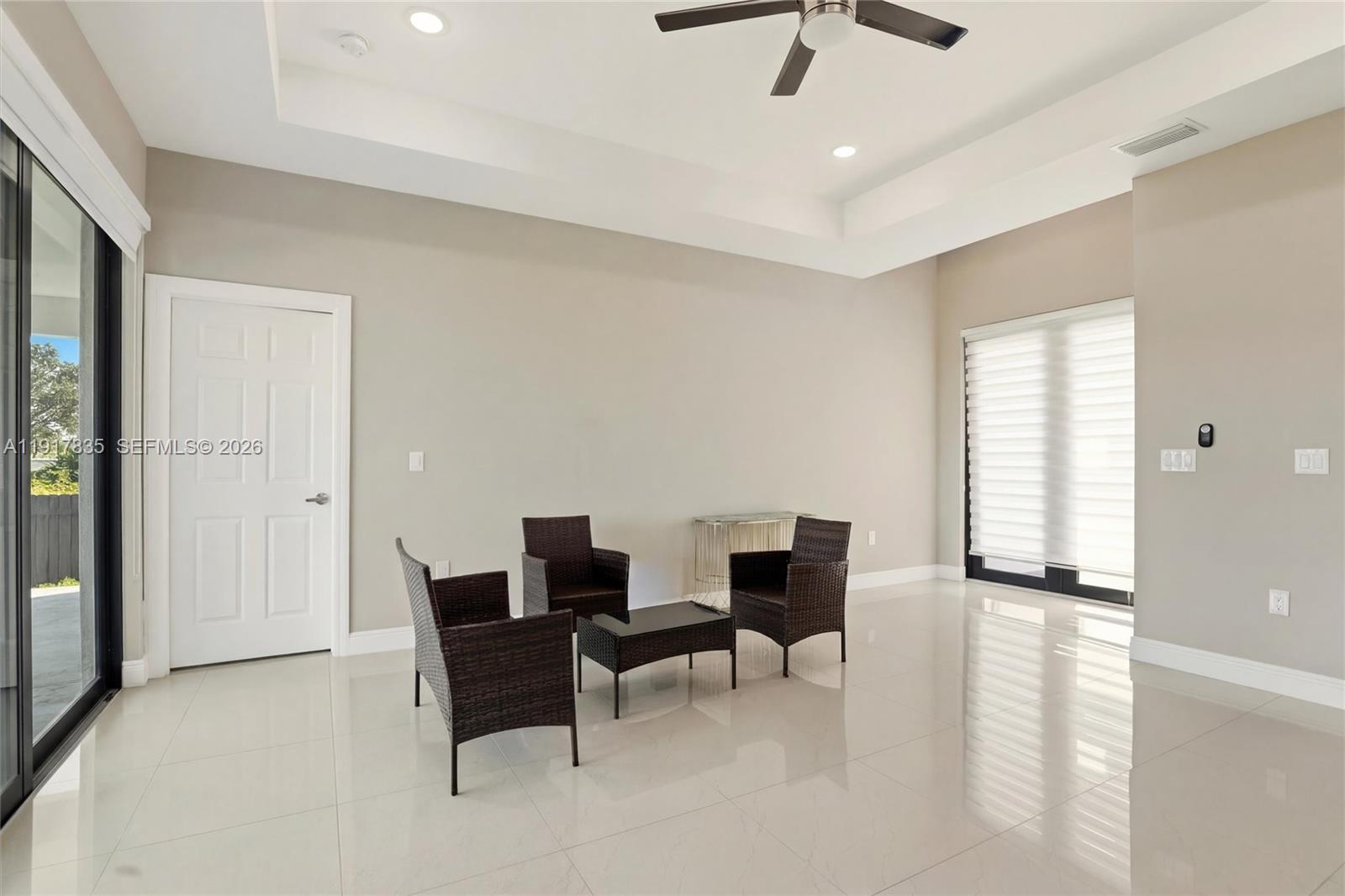2908 9th Street Southwest Lehigh Acres, FL 33976 - Photo 6 of 44 a view of a livingroom with furniture and a ceiling fan