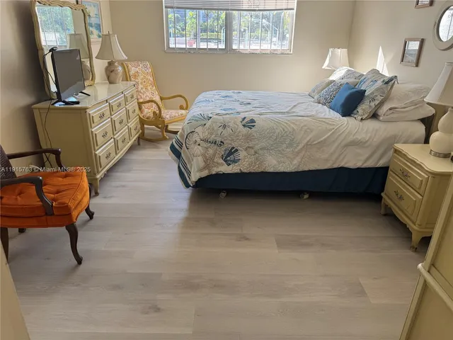 a bathroom with a double vanity sink toilet and shower