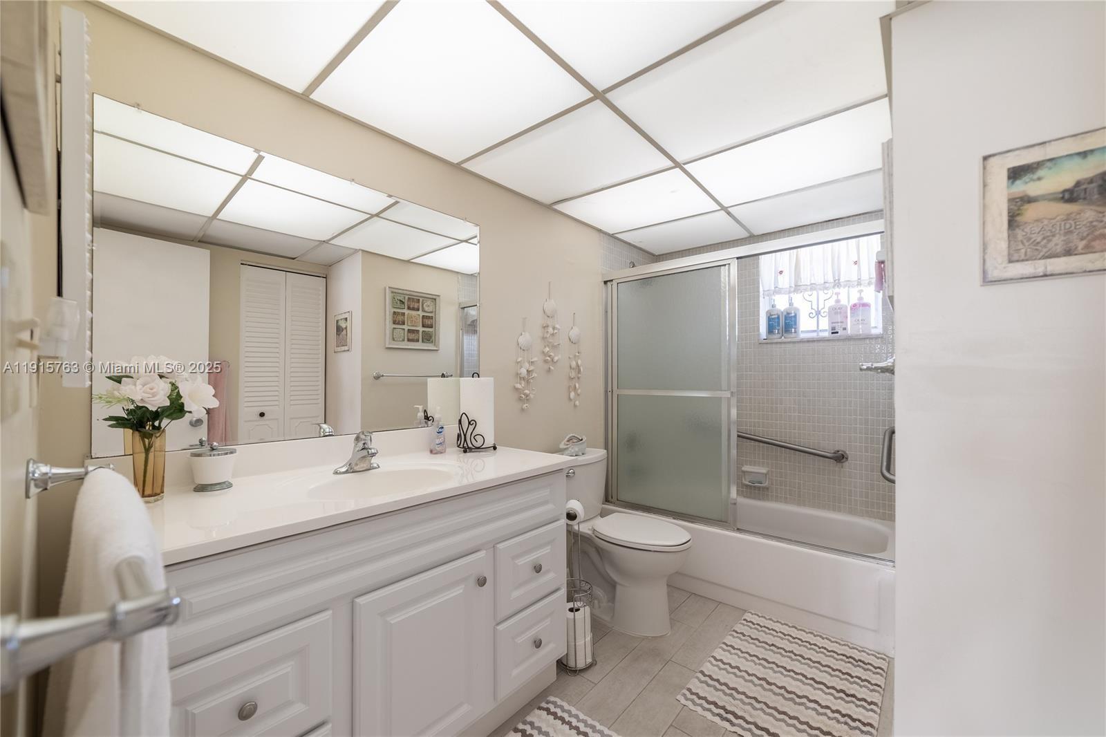 505 East Dania Beach Boulevard, Unit 41K Dania Beach, FL 33004 - Photo 12 of 22 a bathroom with a double vanity sink toilet and shower