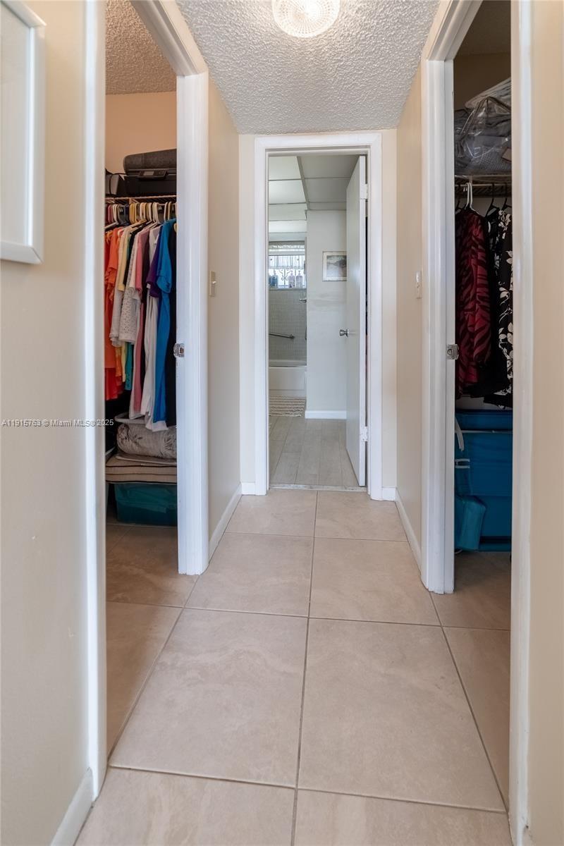 505 East Dania Beach Boulevard, Unit 41K Dania Beach, FL 33004 - Photo 13 of 22 a view of a hallway with wooden shelves and closet
