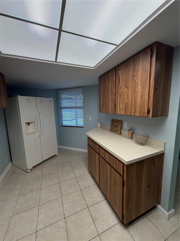 2131 Ridge Road South, Unit 135 Largo, FL 33778 - Photo 14 of 33 a kitchen with a cabinets and window