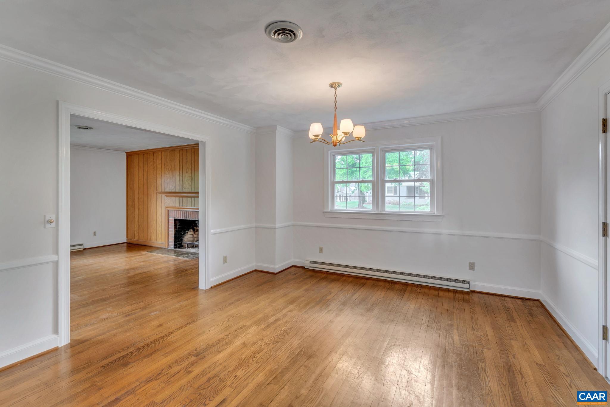 2602 Bennington Road Charlottesville, VA 22901 - Photo 11 of 50 an empty room with wooden floor and windows