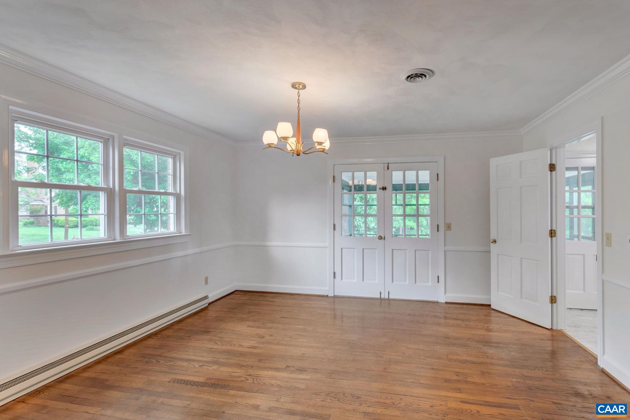 2602 Bennington Road Charlottesville, VA 22901 - Photo 12 of 50 a view of empty room with wooden floor and fan
