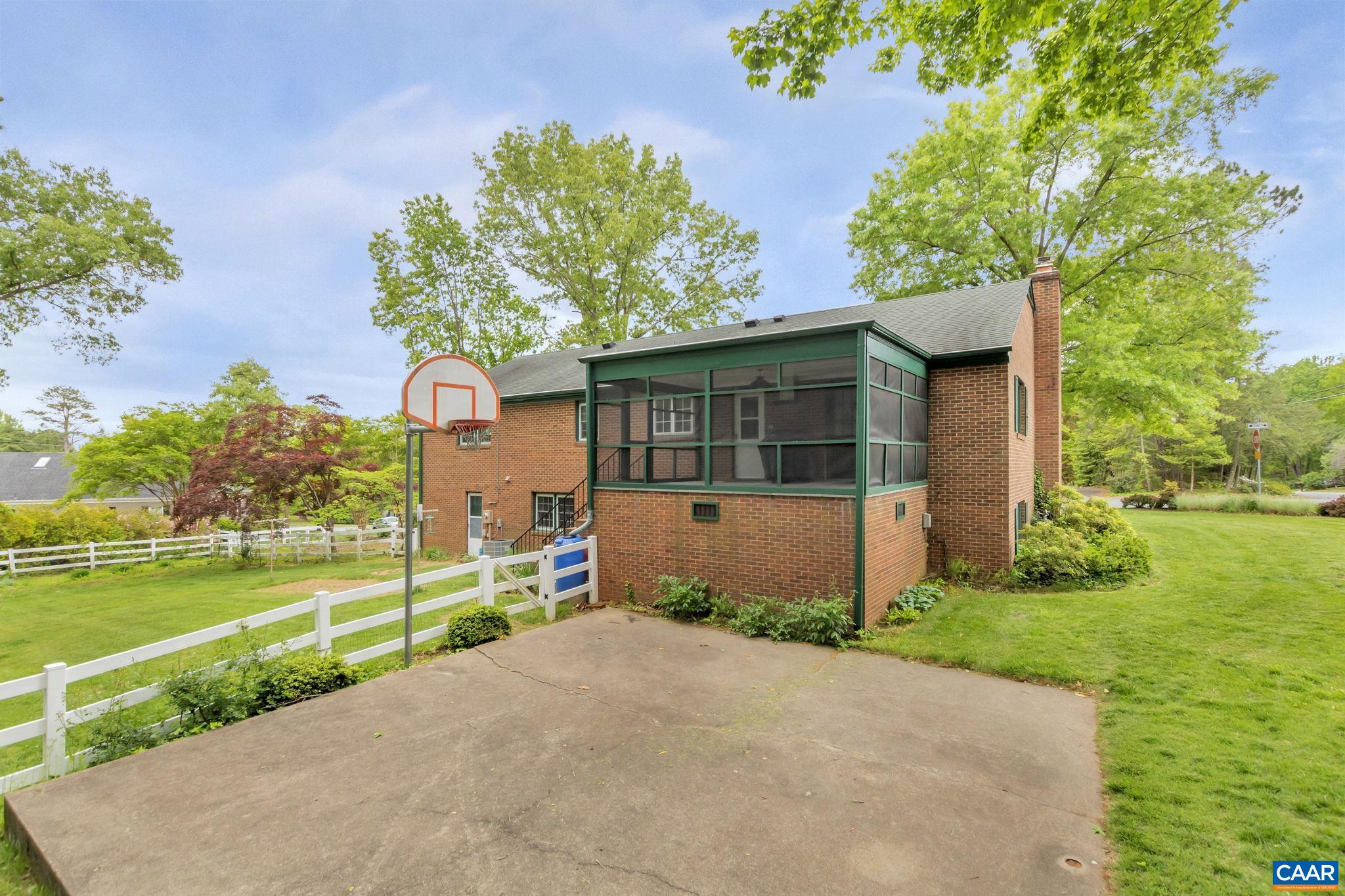 2602 Bennington Road Charlottesville, VA 22901 - Photo 39 of 50 a front view of a house with a yard and potted plants