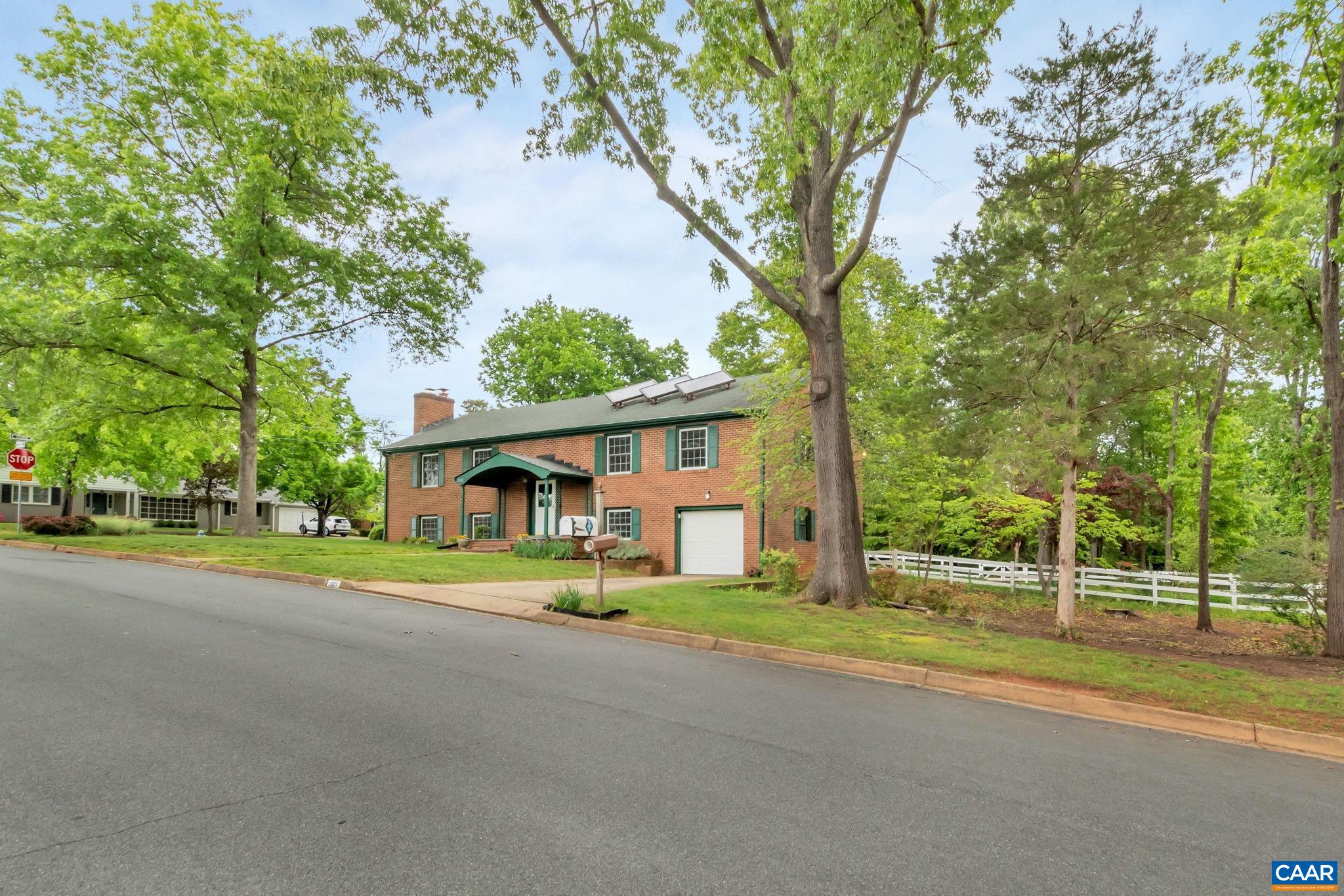 2602 Bennington Road Charlottesville, VA 22901 - Photo 4 of 50 a view of a house with a big yard and large trees