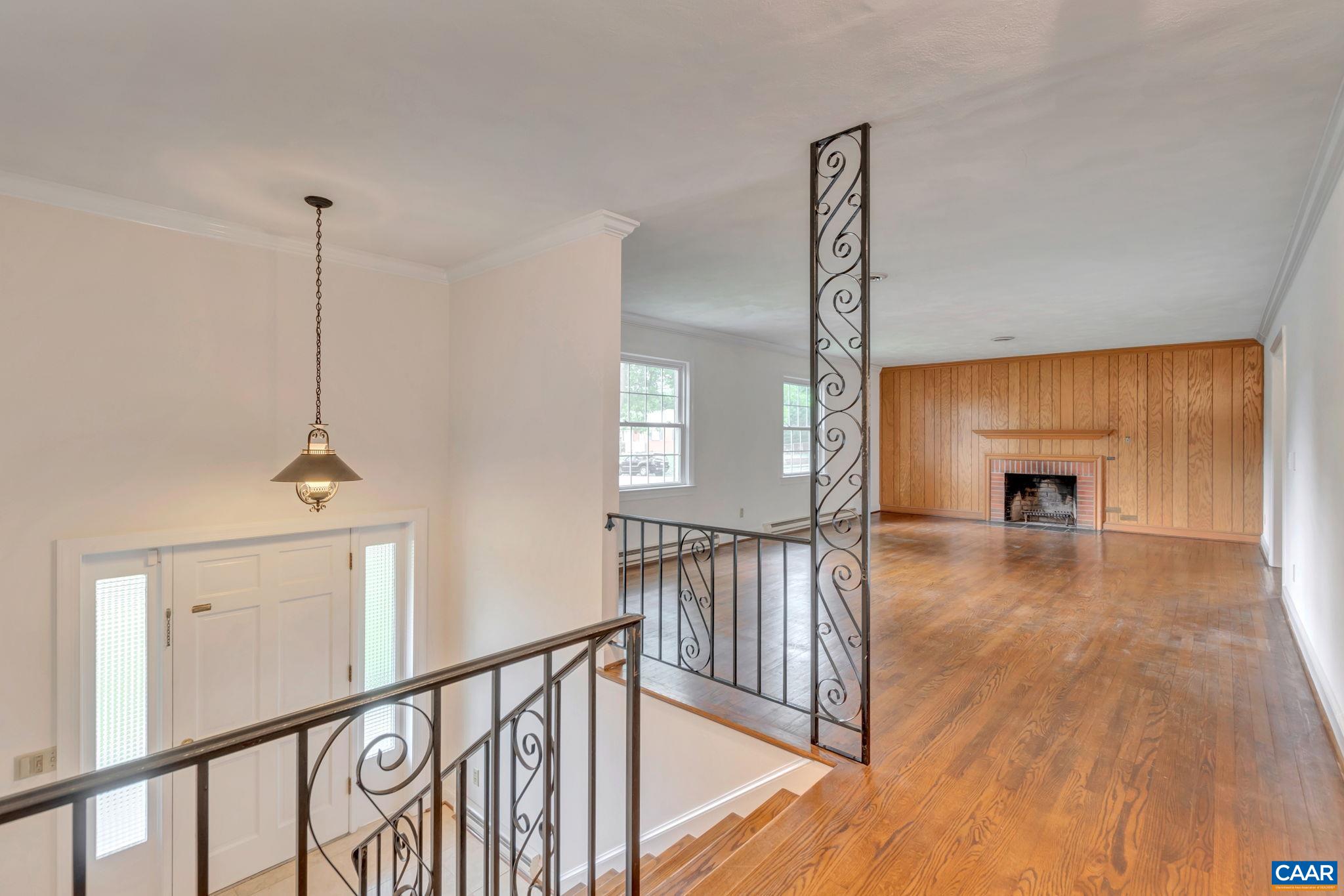 2602 Bennington Road Charlottesville, VA 22901 - Photo 7 of 50 a view of a hallway with wooden floor and stairs