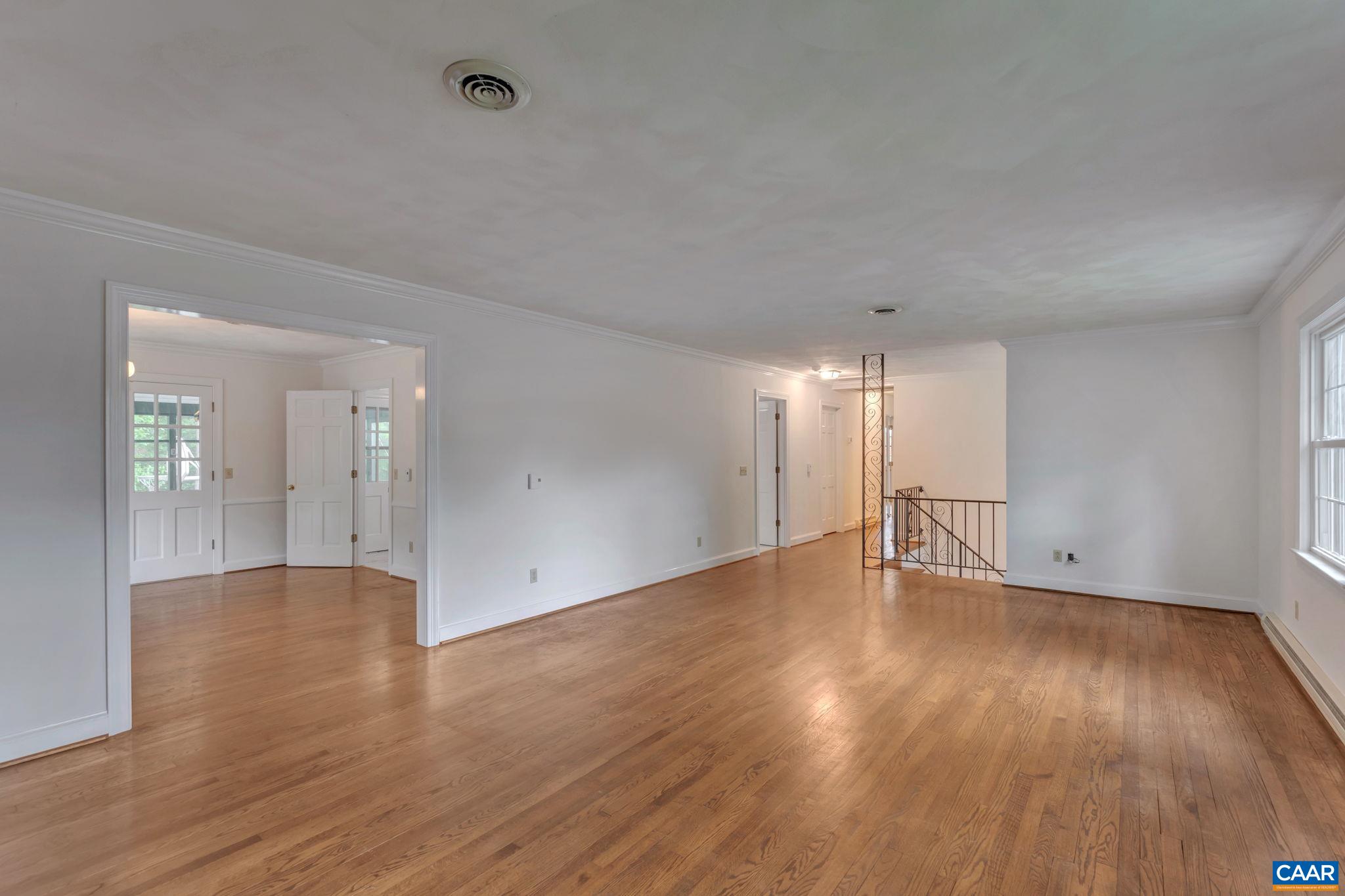 2602 Bennington Road Charlottesville, VA 22901 - Photo 10 of 50 a view of an empty room with wooden floor and a window