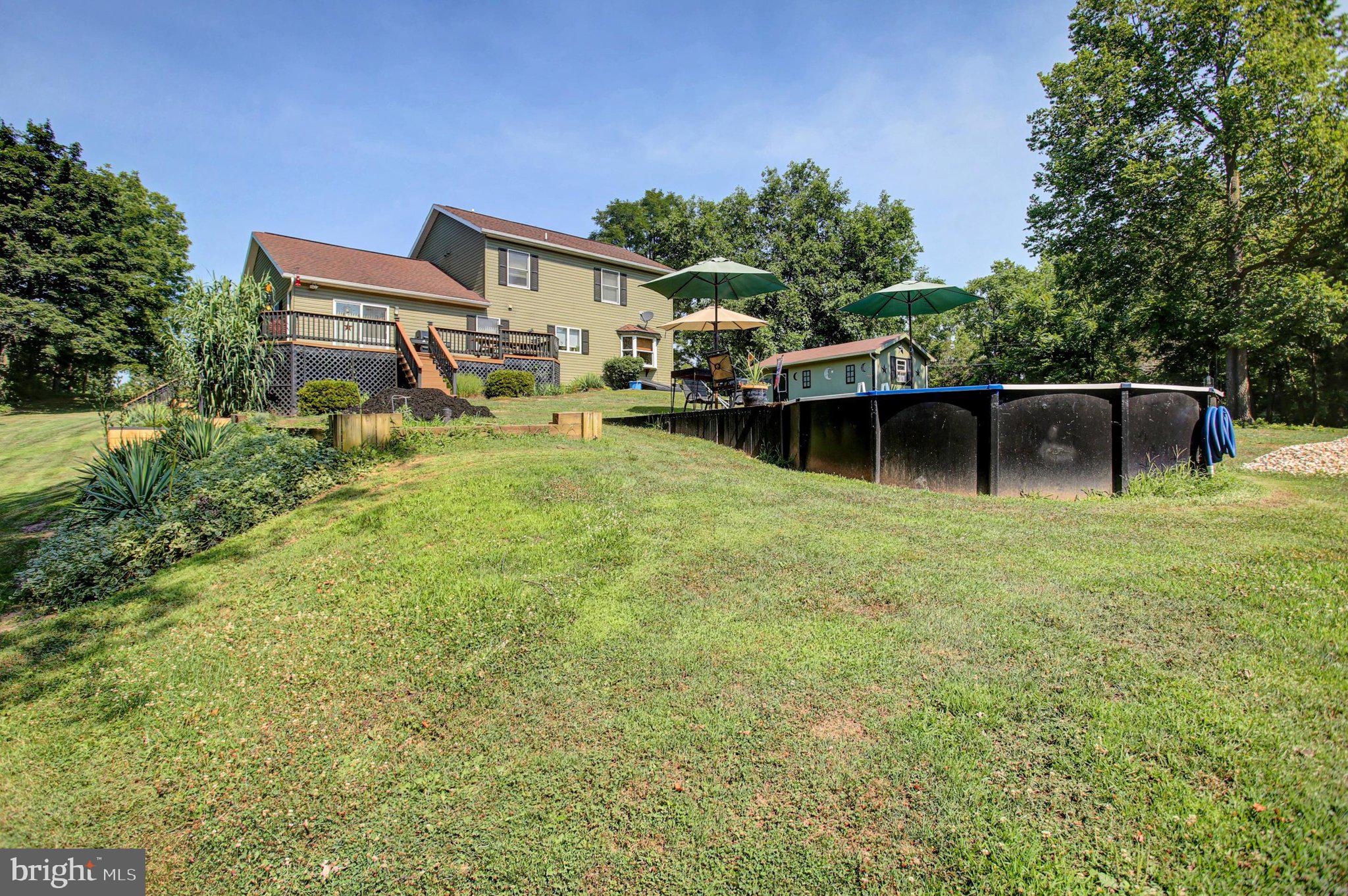 11086 Welsh Run Road Greencastle, PA 17225 - Photo 57 of 63 a front view of a house with garden