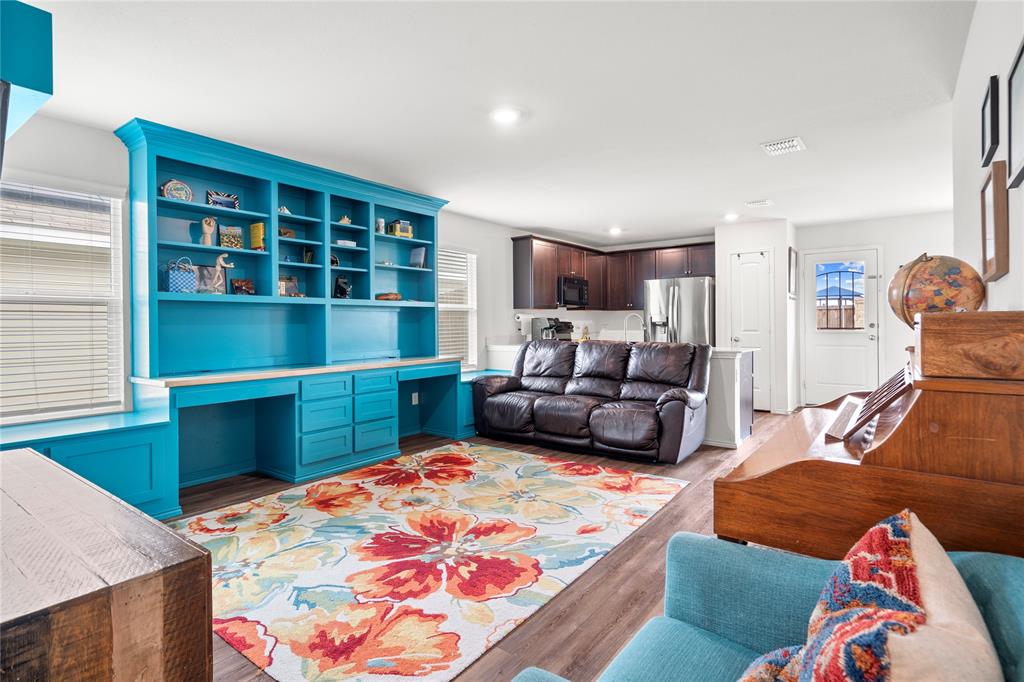 5213 Longshadow Drive Princeton, TX 75407 - Photo 1 of 1 a bedroom with a bed and a cabinets