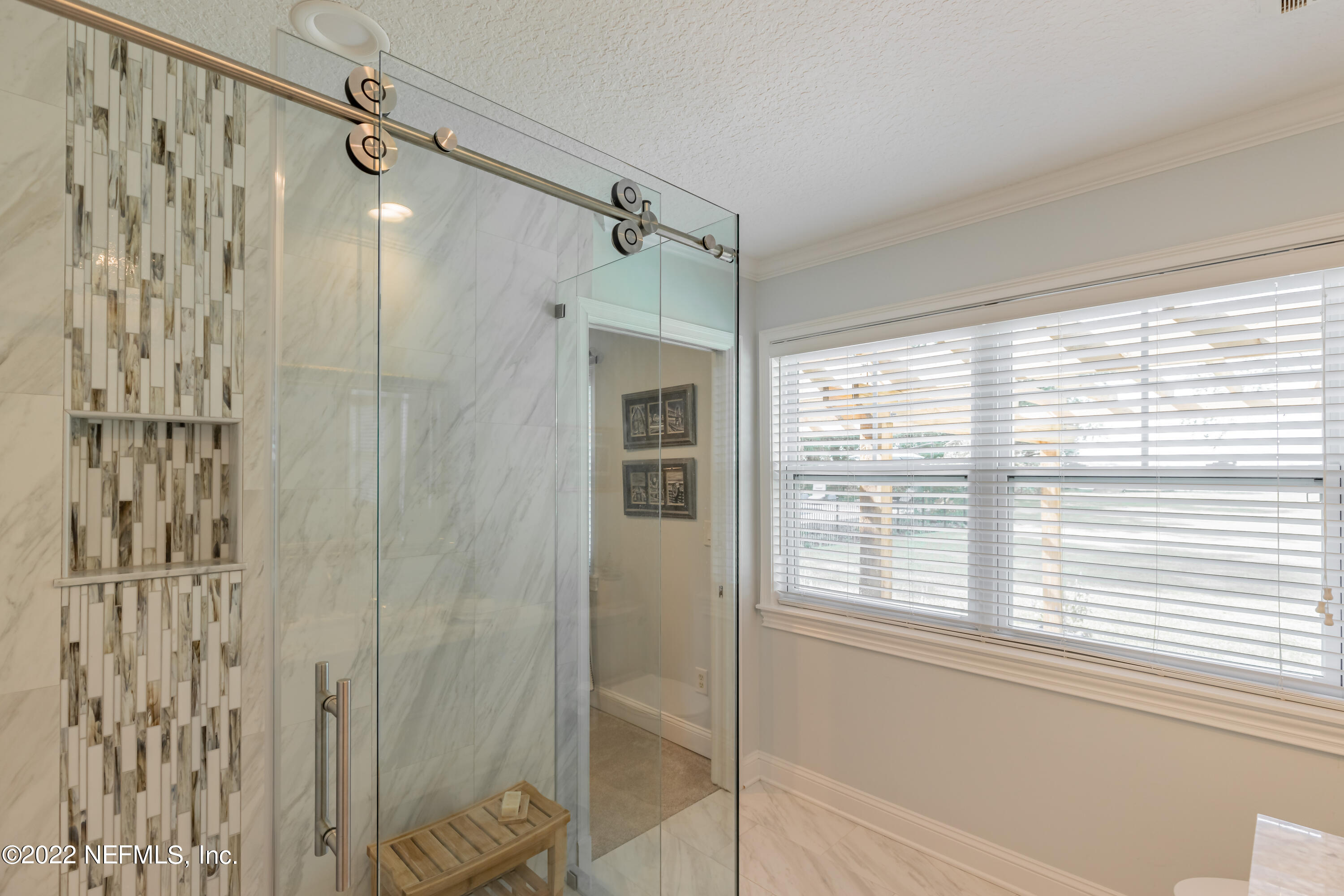 2532 Holly Point Road West Orange Park, FL 32073 - Photo 54 of 89 a bathroom with a shower and a window